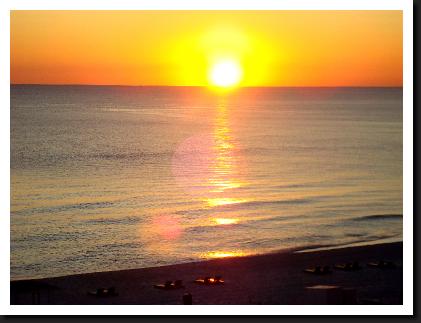 sunset on water of panama city beach