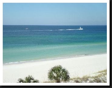 Boat on water in front of condo at Moonspinner