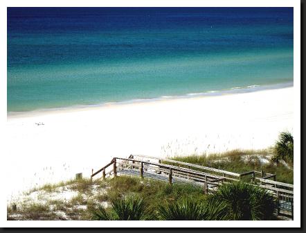 Panama city beach walkway to the beach from Moonspinner beach resort blue water and white sand.